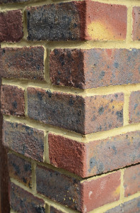 Brickwork on the side of a house seen from the corner