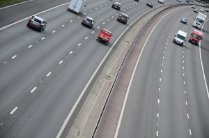 The M3 motorway seen at an angle so it curves away to the top right